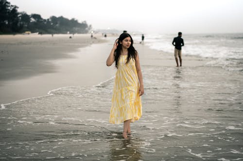 Woman Walking on the Beach