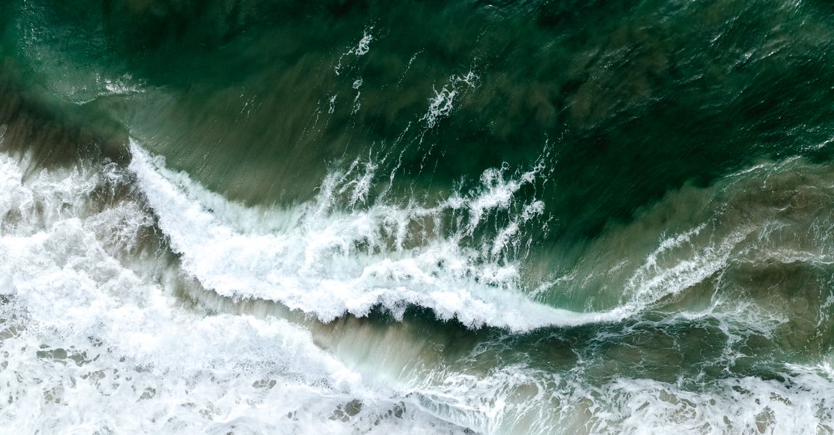 Washing Wave Aerial View of Waves Washing up the Beach · Free Stock Photo