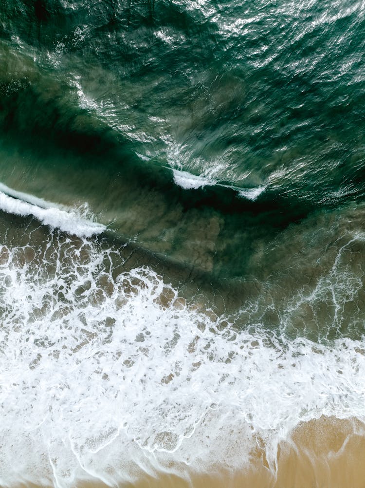 Birds Eye View Of Waves On Shore