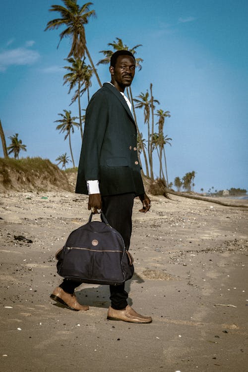 Man Walking on the Beach