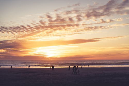 People on Beach at Sunset