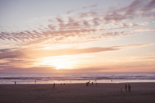 Free Sunset over Ocean Shore in California, USA Stock Photo
