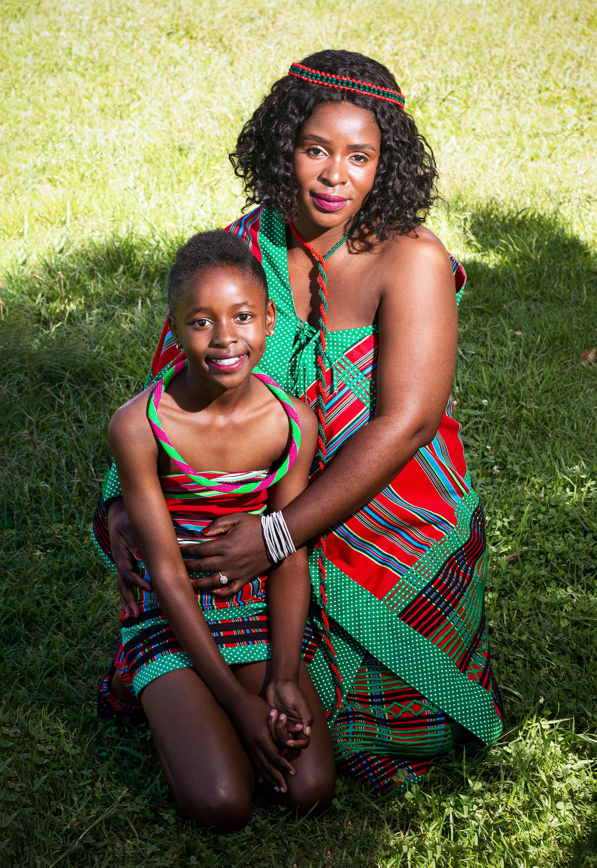 A South African mother and daughter standing together outdoors