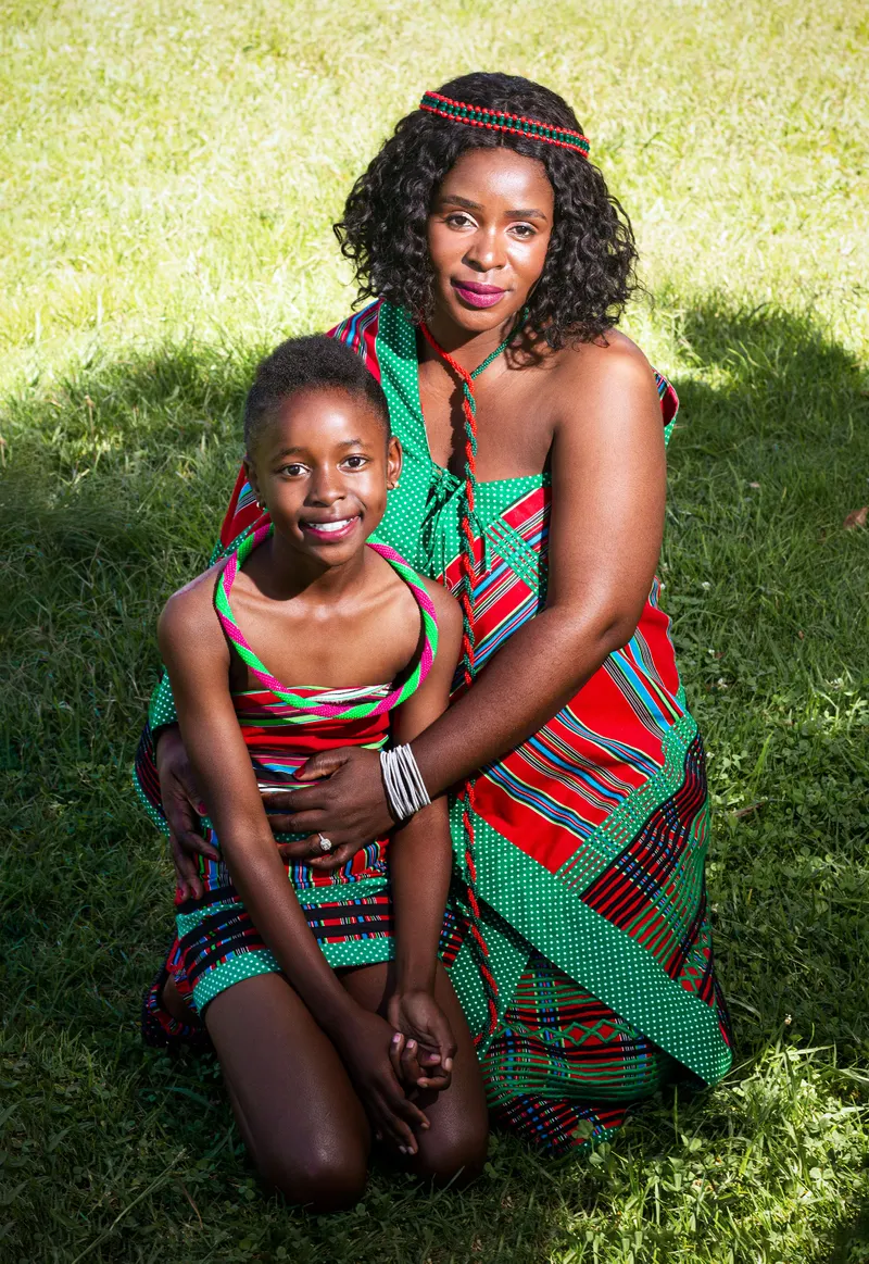 A South African mother and daughter standing together outdoors
