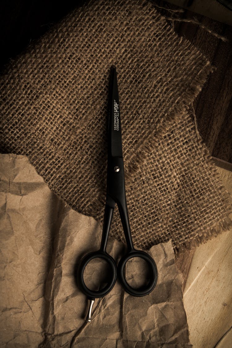 Scissors On Pieces Of Fabric And Paper