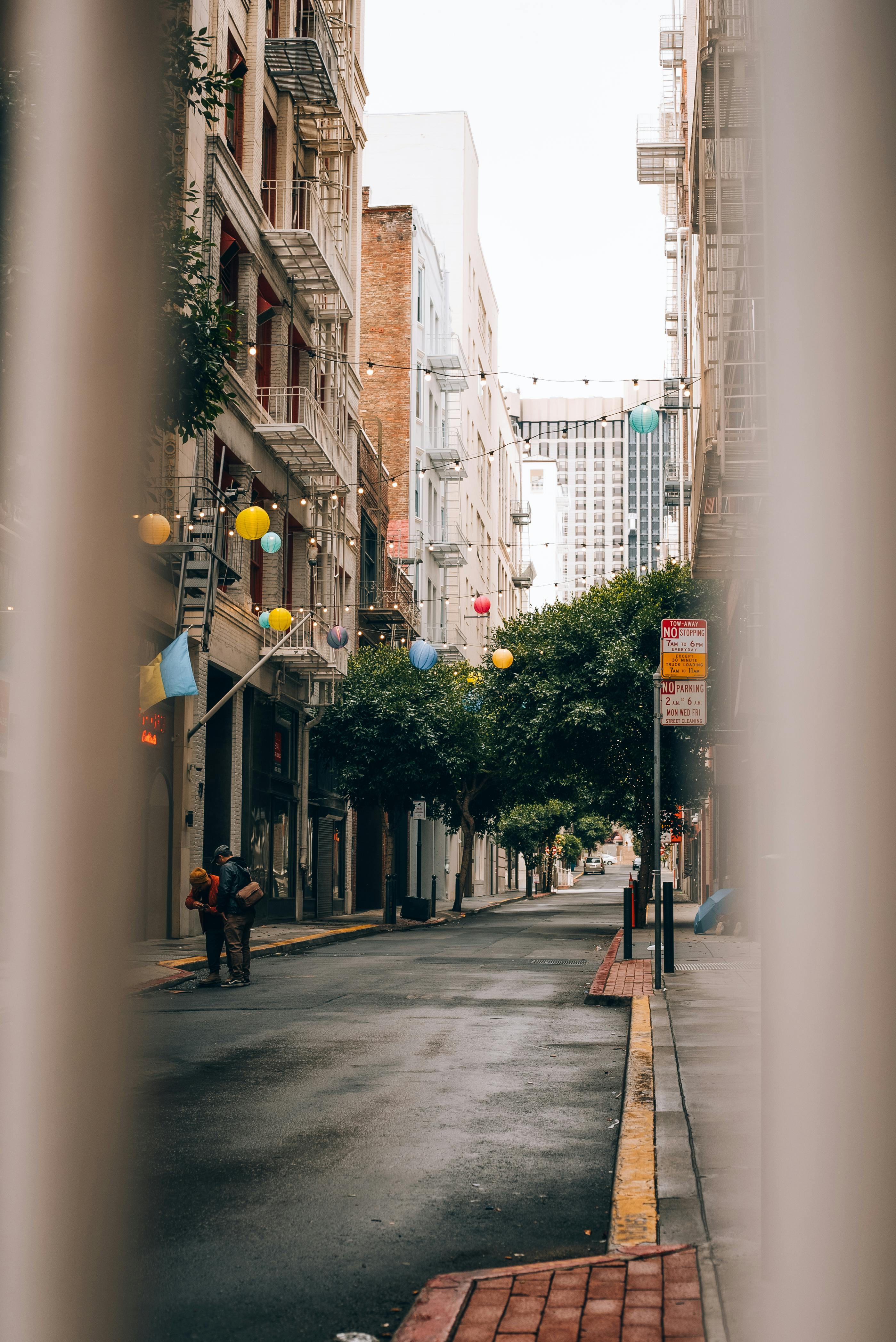 a street view of a city street with a person walking