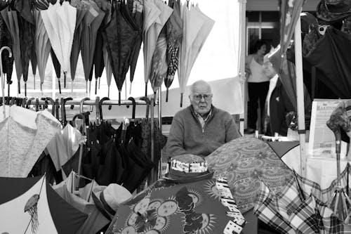 Free stock photo of old man, umbrellas