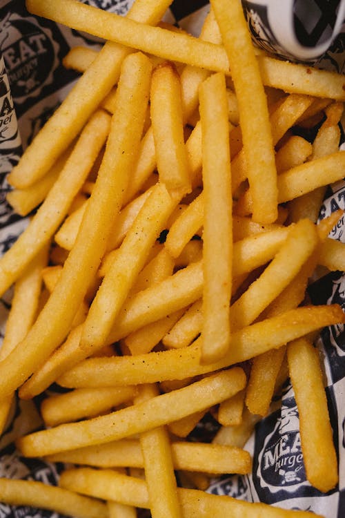 French Fries in Brown Paper Bag Stock Photo - Image of fattening