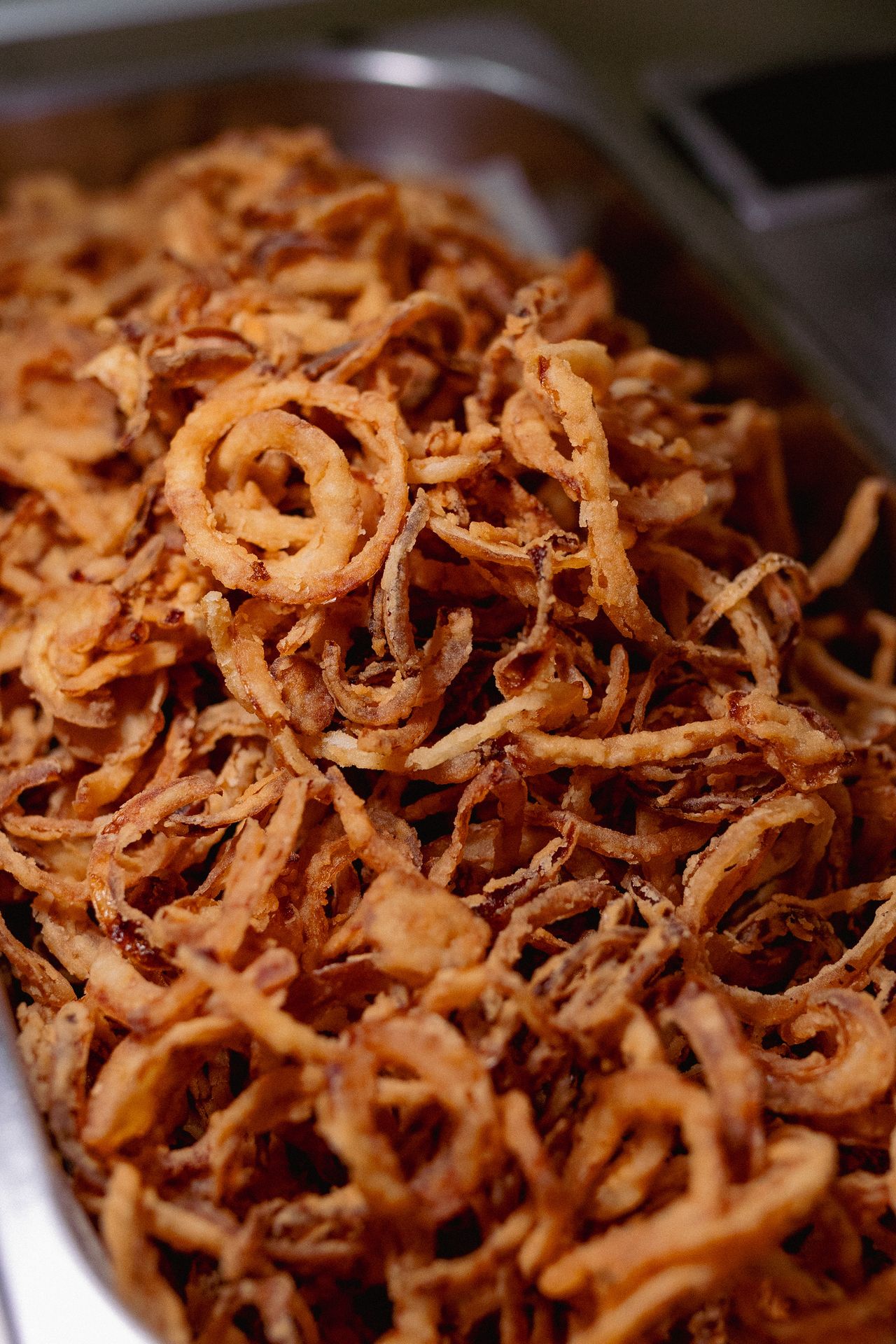 Close-up of crispy fried onion straws