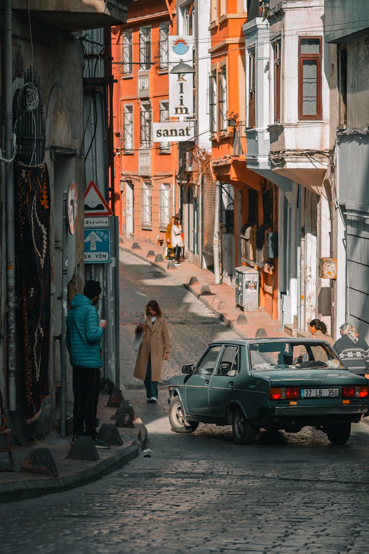 Car And People In Narrow Alley