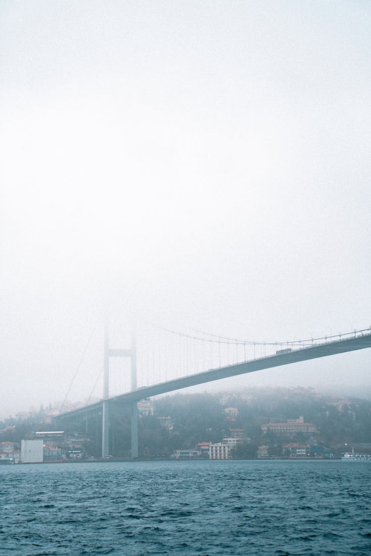 Bridge Above River In Fog