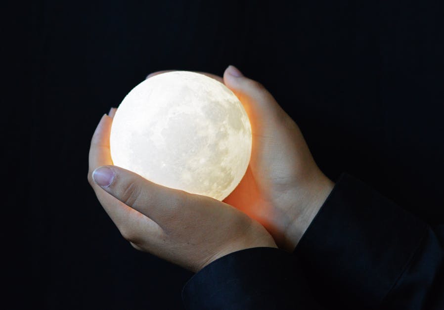 Free stock photo of full moon, hands, hands holding full moon