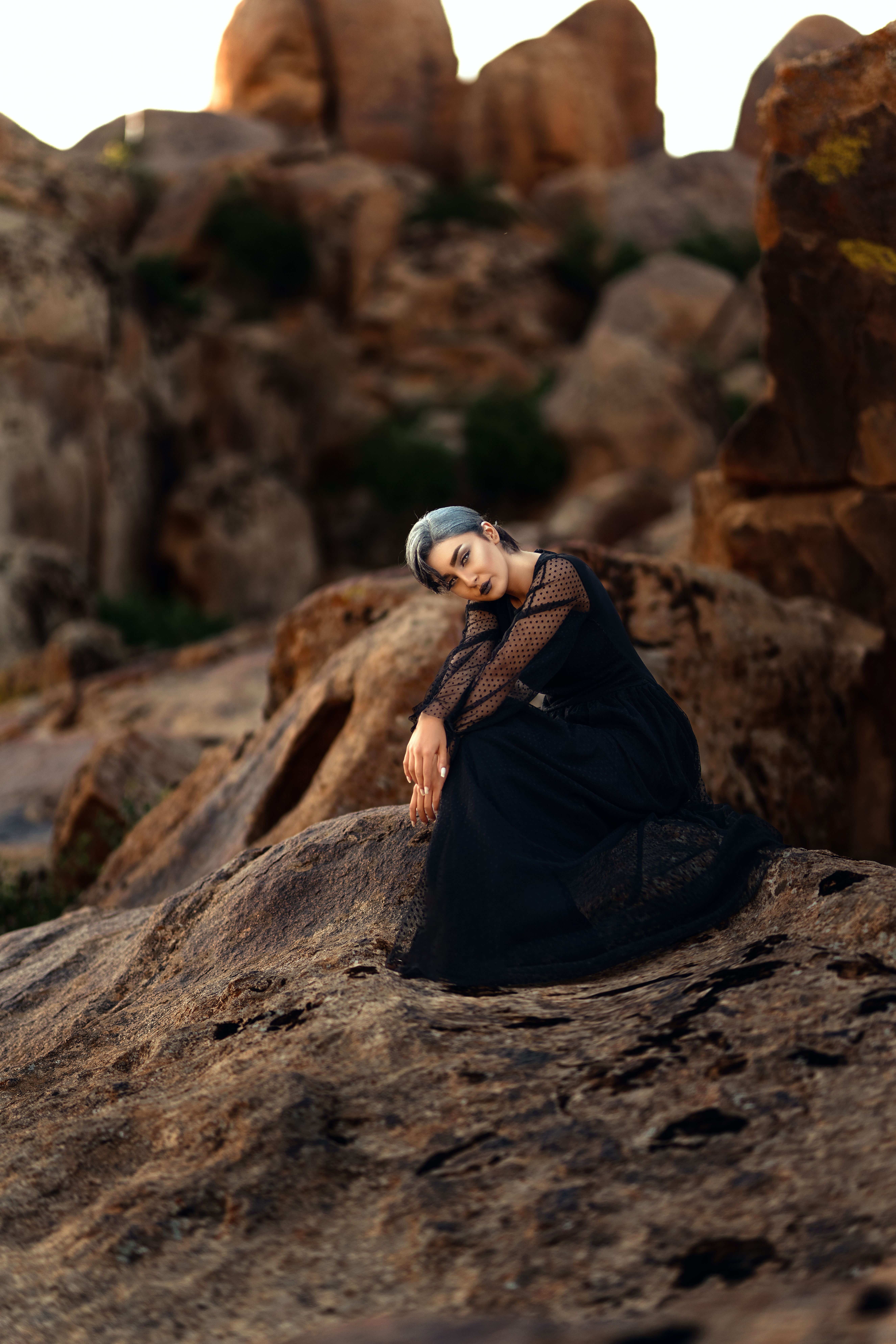 Woman in Black Dress on Rocks · Free Stock Photo