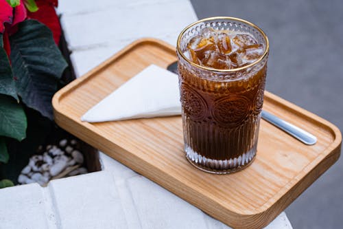 Refreshing Cold Drink on Wooden Board
