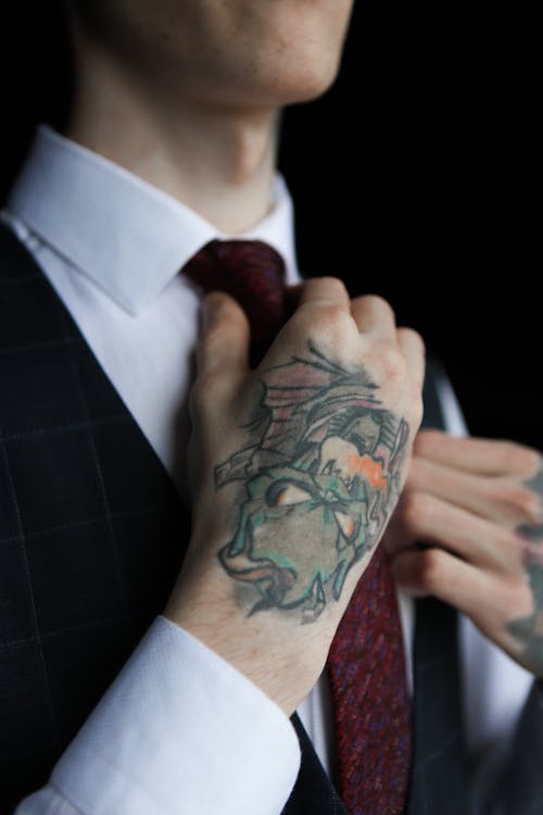 Man with Tattoos in Necktie