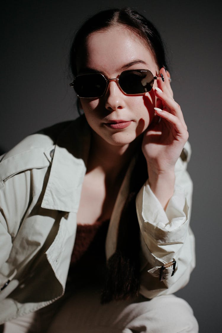 Woman In Sunglasses Posing In Studio