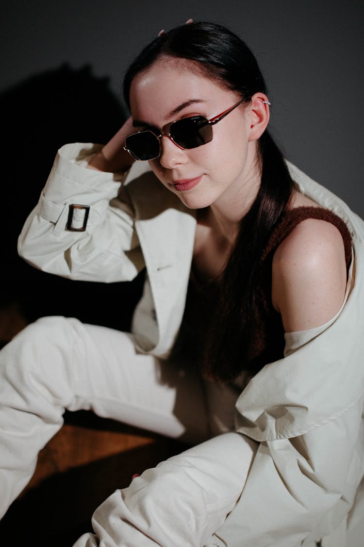 Woman In Sunglasses Posing In Studio