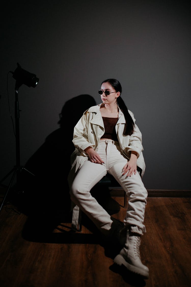 Woman In Sunglasses Posing In Studio