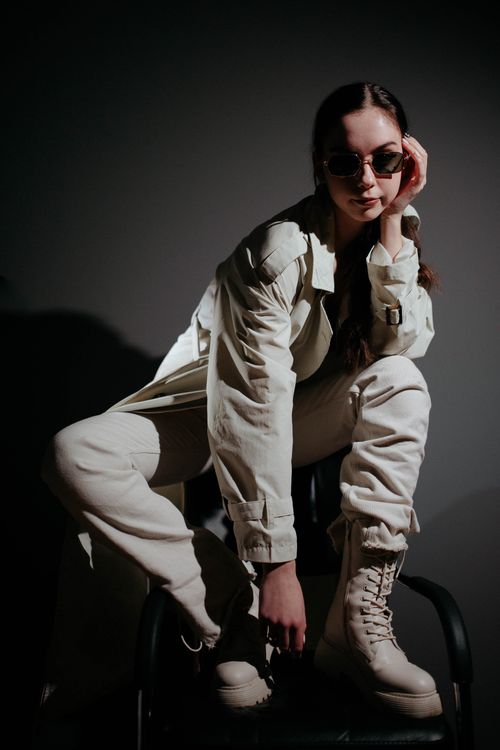 Young Woman in a Fashionable Outfit Posing in Studio · Free Stock Photo