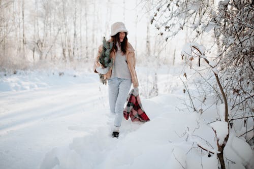 Woman Walking Outdoors in Snow 