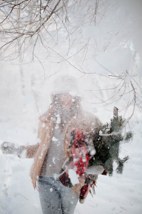 Woman Standing Outdoors in Heavy Snow 