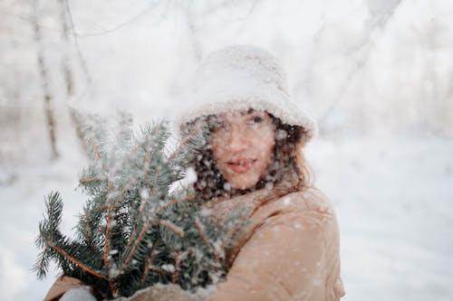 Woman With Christmas Tree on Winter Day