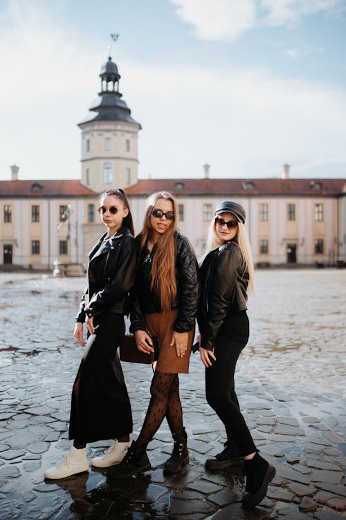 Models Posing in Leather Jackets and Sunglasses
