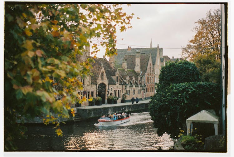 People On Boat On River In Belgium