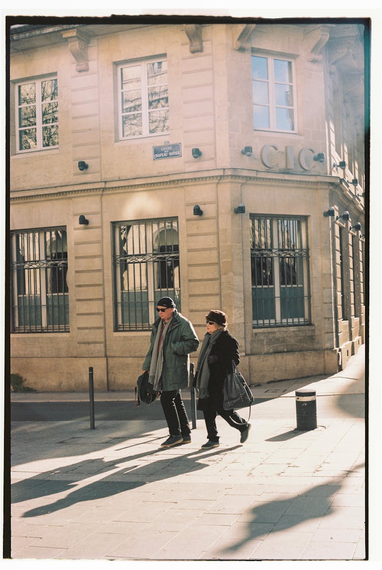 Old People Walking On City Street