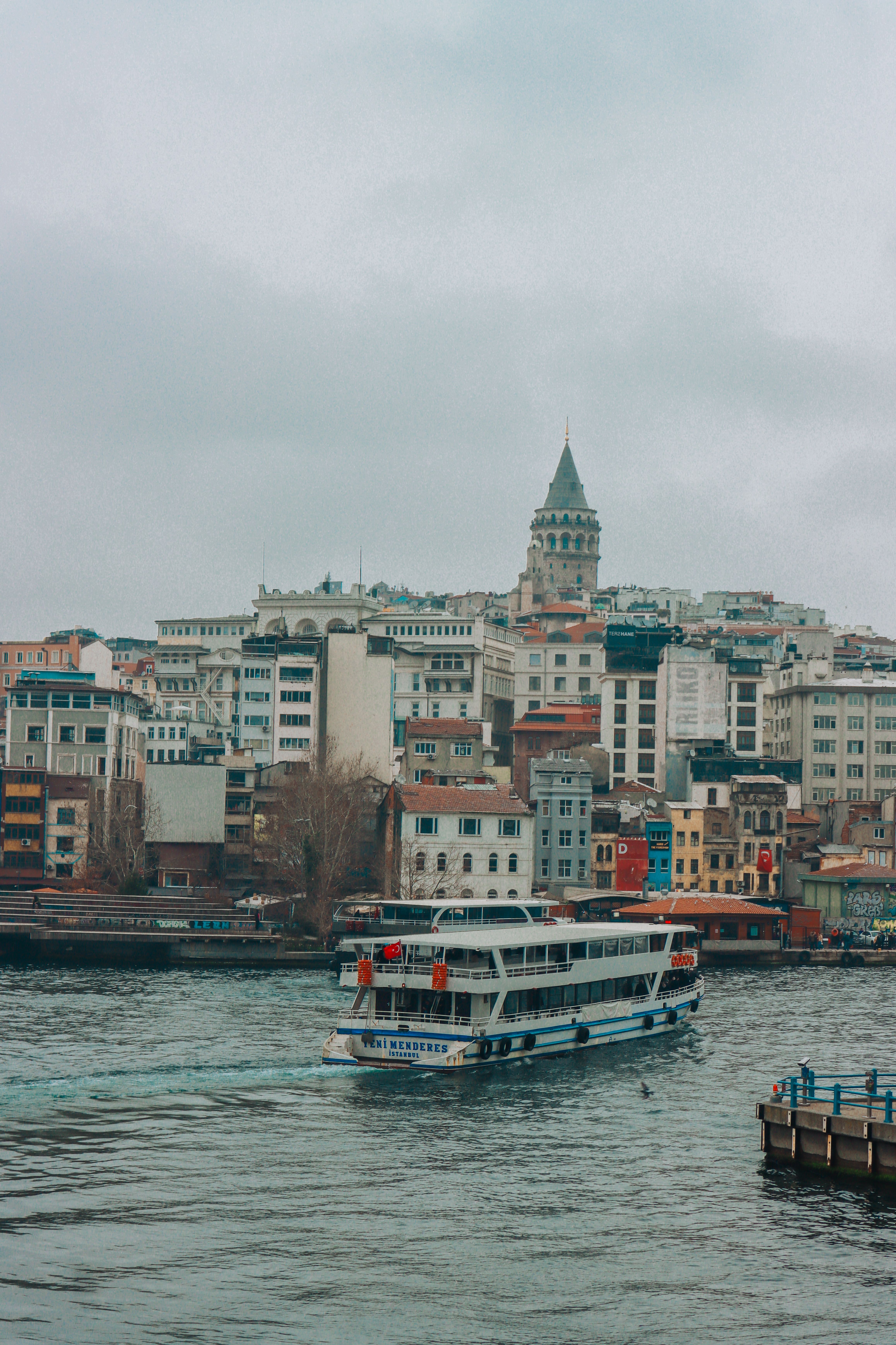 Ferry in Harbor on Cloudy Day · Free Stock Photo