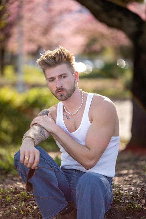 Man in Tank Top Sitting