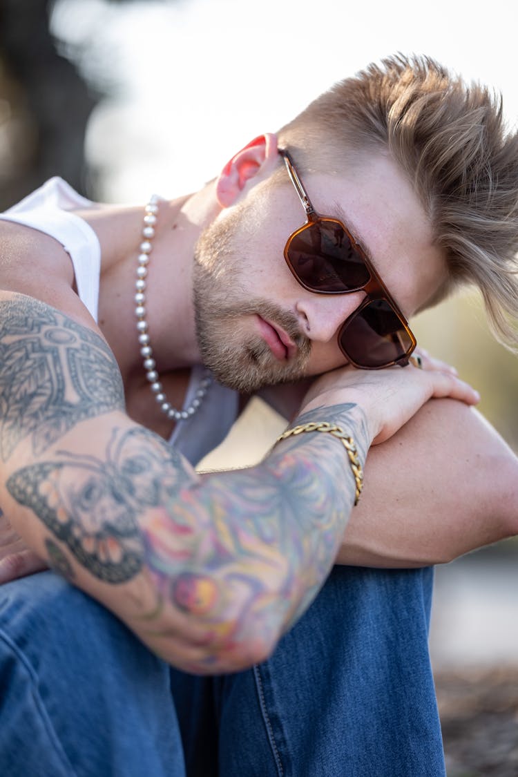 Man With Tattoo And Sunglasses