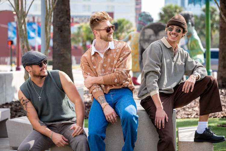 Laughing Men Hanging Out In A Park