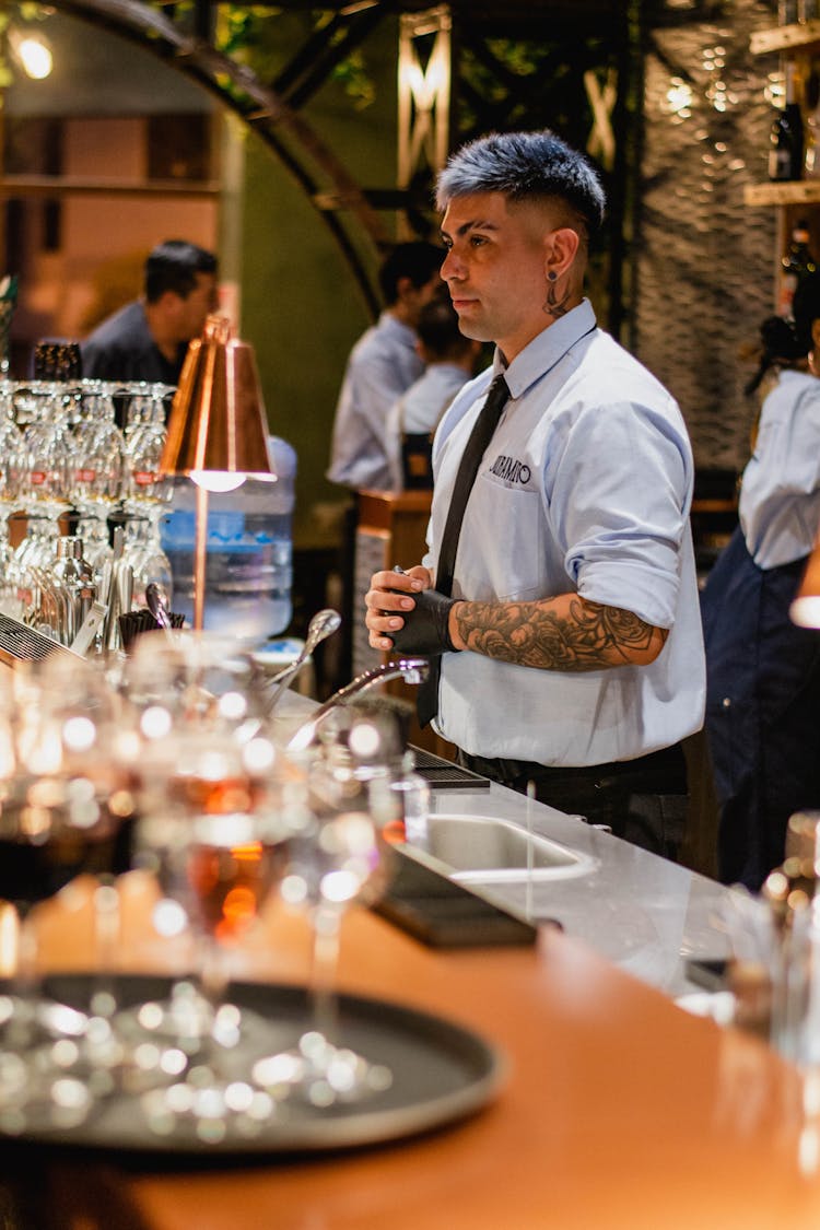 Bartender Making Cocktails At Bar