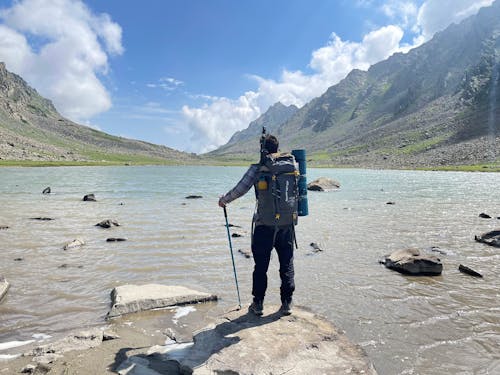 Photo of a Tourist at a Mountain Lake