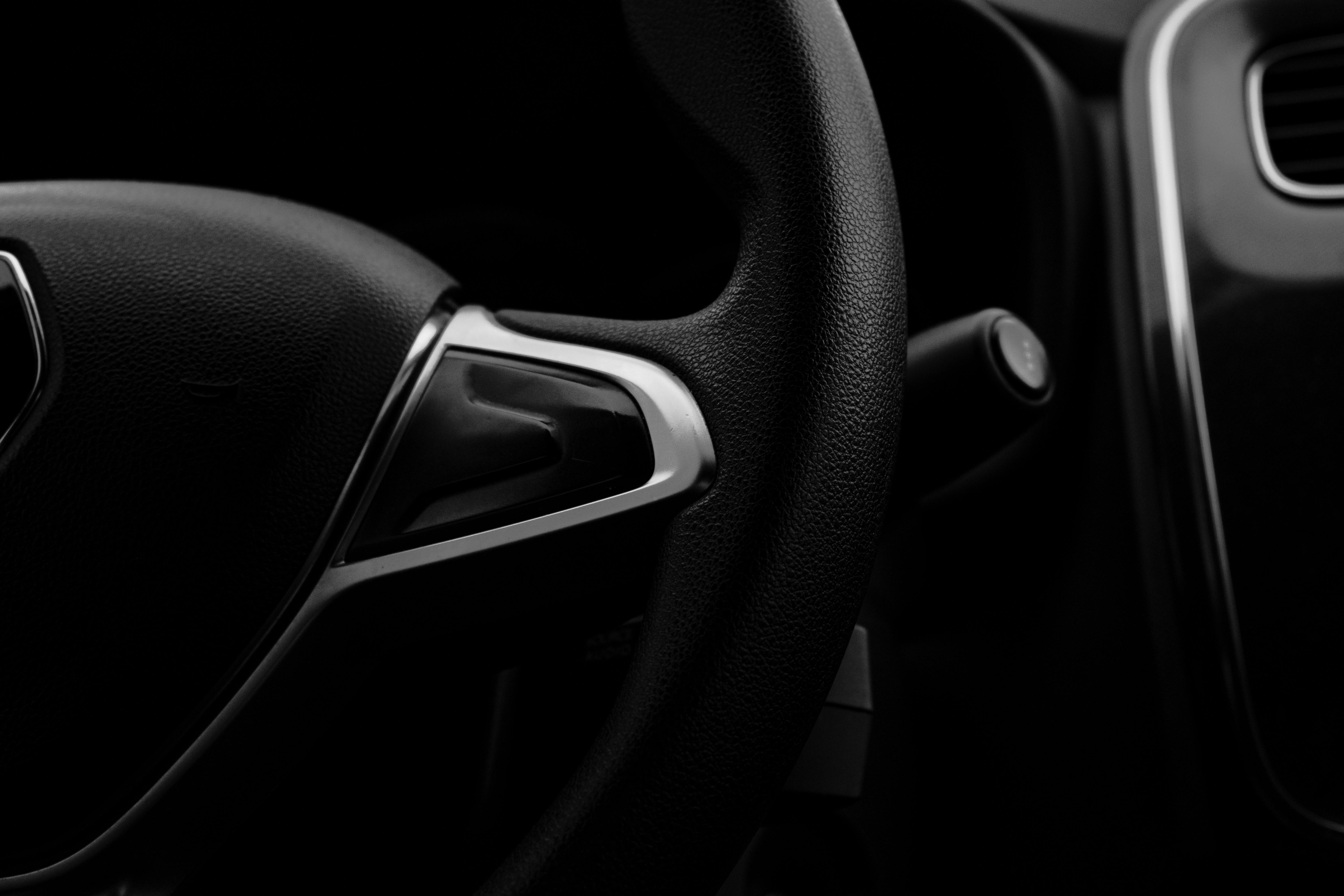 Closeup Photo of a Steering Wheel in a Car · Free Stock Photo