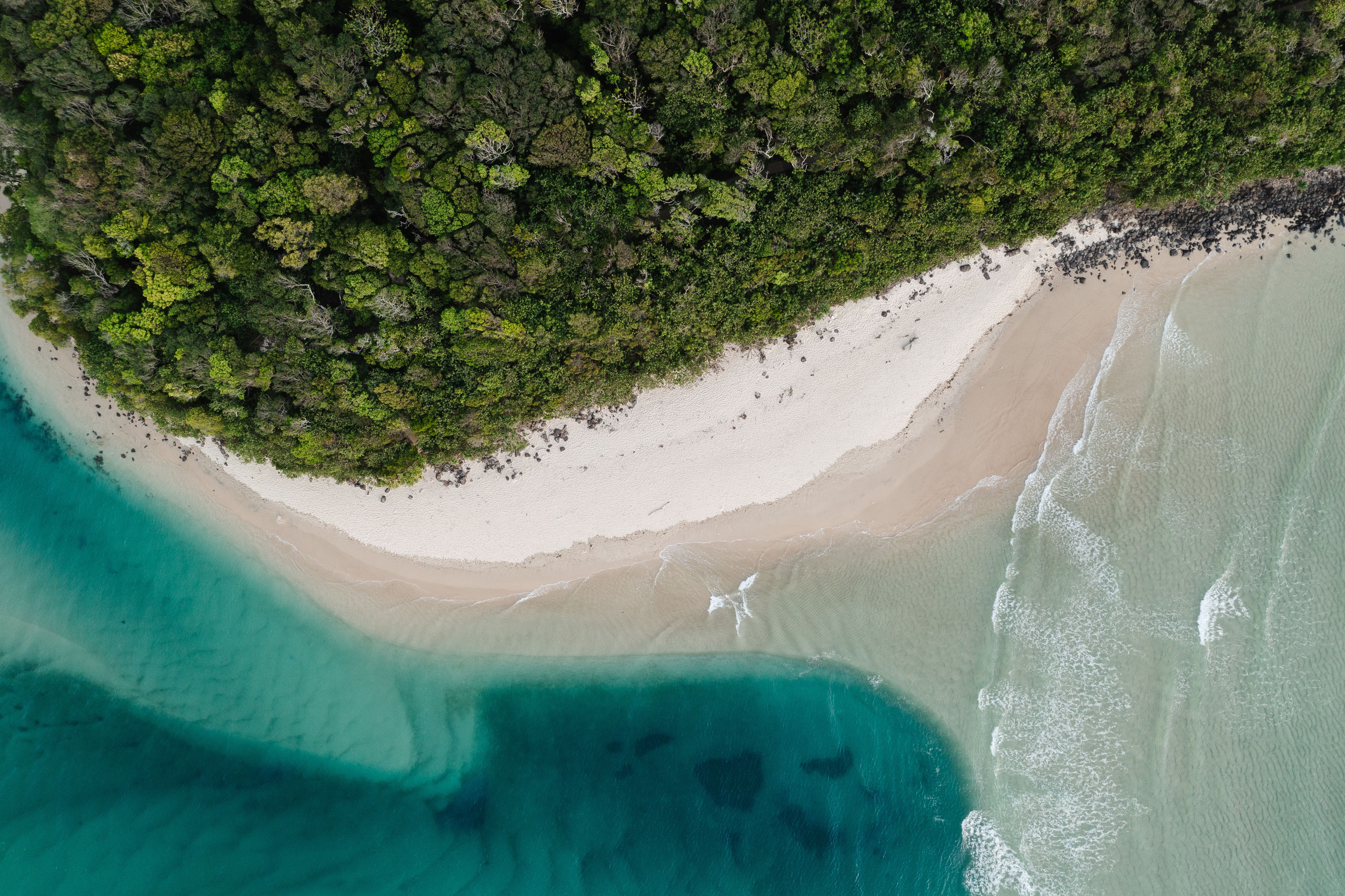 Hunter Valley Romantic Bubbly Breakfast Helicopter Tour from Cessnock - Breathtaking aerial view of Burleigh Heads beach with lush forest and turquoise waves.