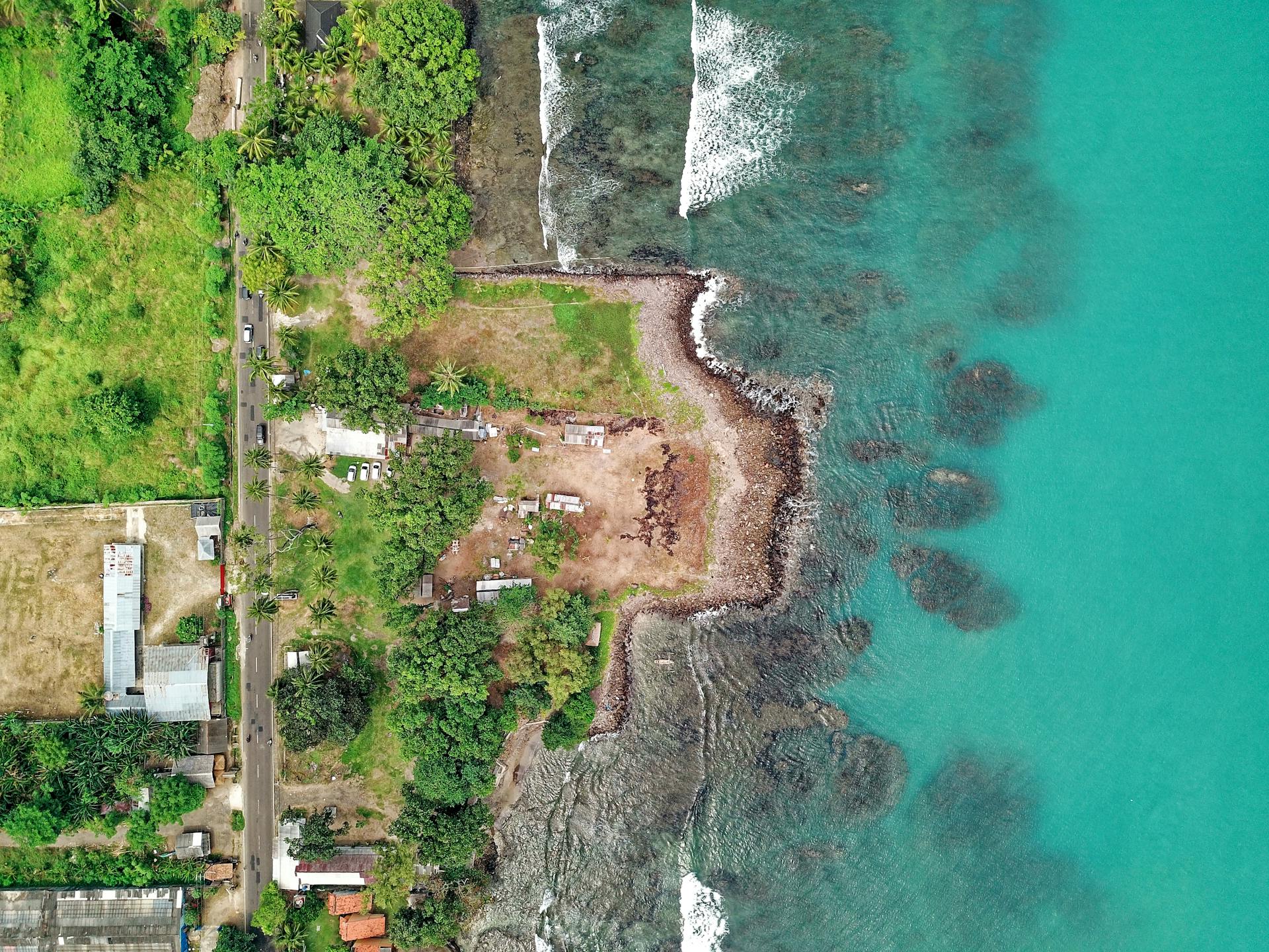 Stunning aerial shot of Anyar beach coastline in Indonesia with vibrant ocean colors.