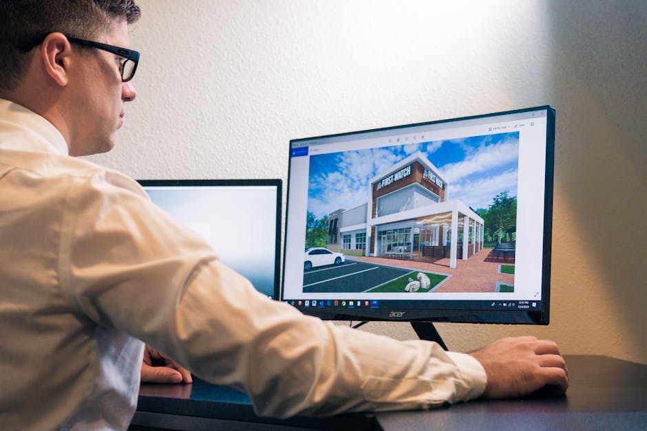 architect reviewing a 3D model of a commercial building on a computer screen - commercial building design architect reviewing a 3D model of a commercial building on a computer screen - commercial building design