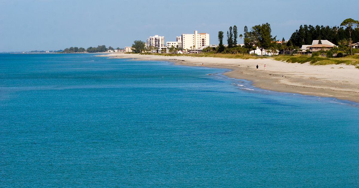 Peaceful stretch of sand and blue waters on a sunny day in Venice, Florida.