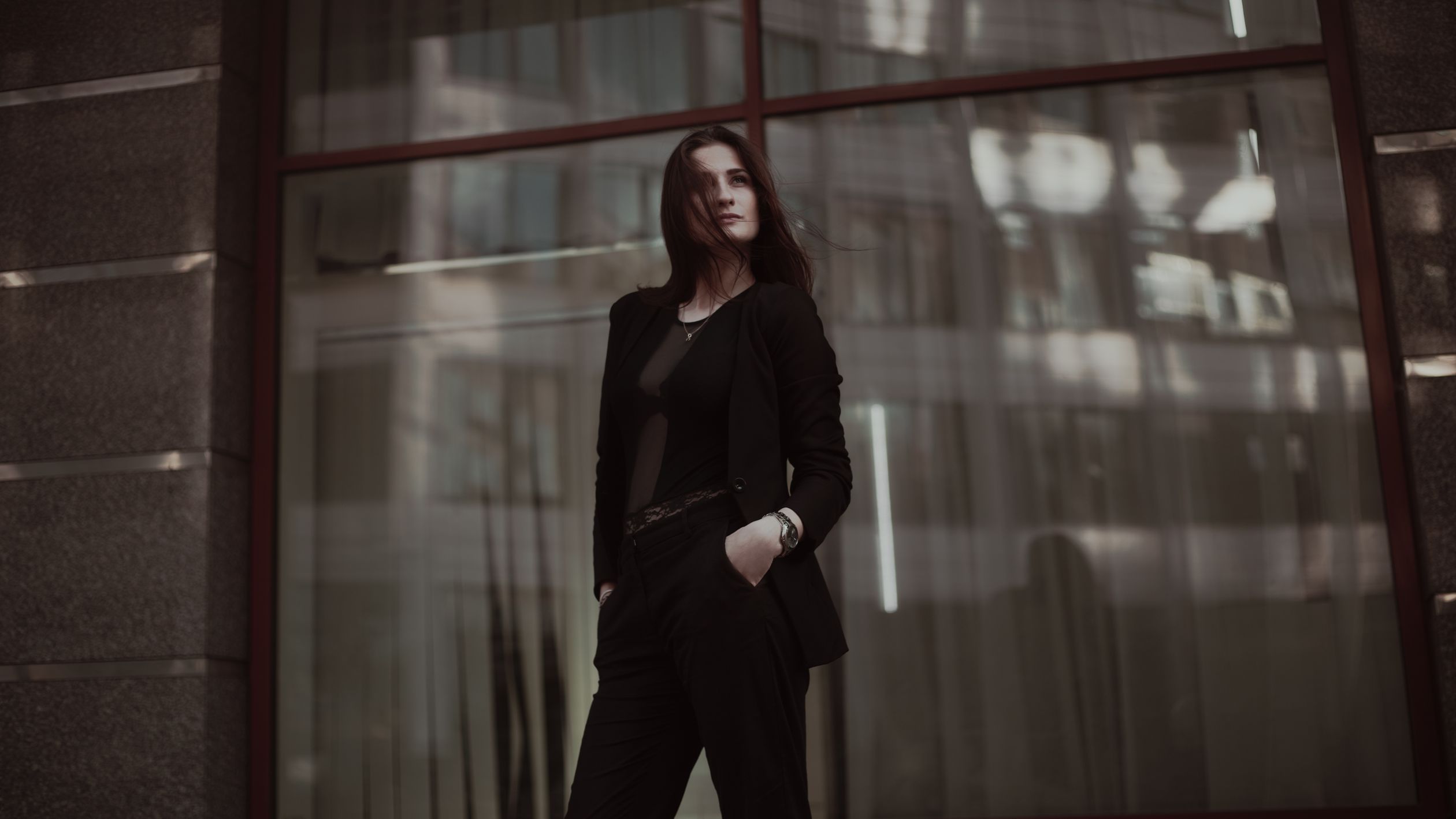 Woman Standing Near Clear Glass Window · Free Stock Photo