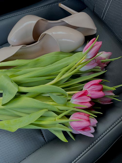 High Heels and a Bunch of Tulips Lying in a Car
