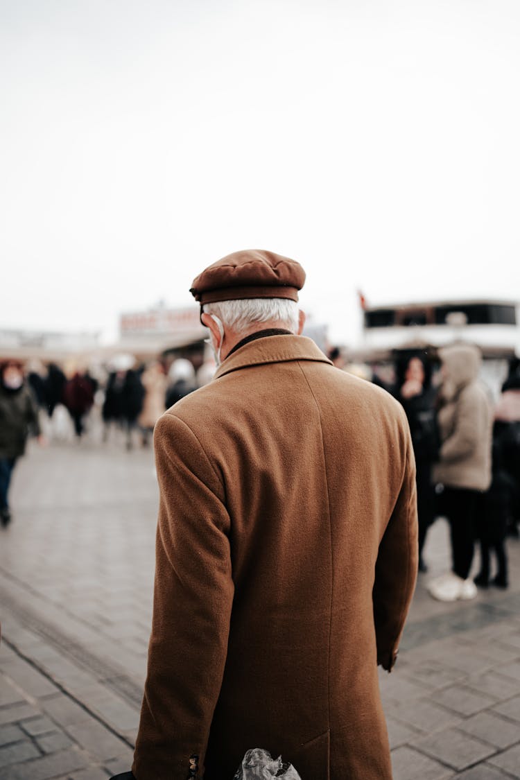 A Man Walking In A City 