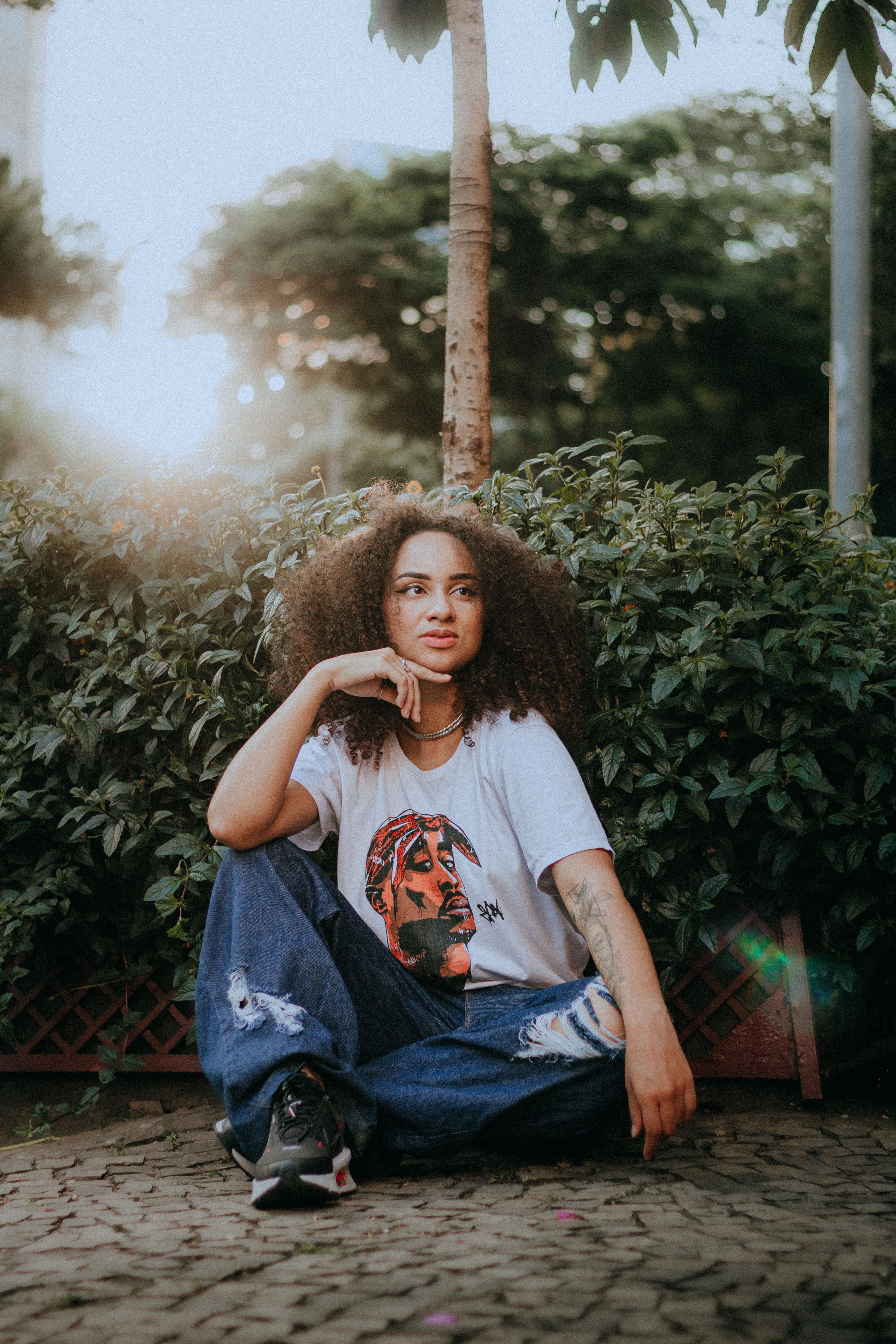 Portrait of a Woman Sitting on the Ground · Free Stock Photo