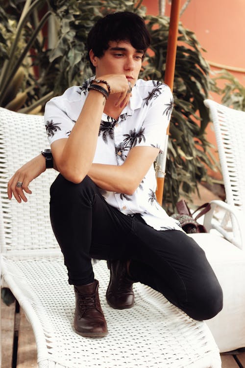 Young Man Posing on Sunbed in Yard