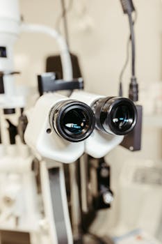 Close-up of binocular eye examination device used in optometry and ophthalmology clinics.