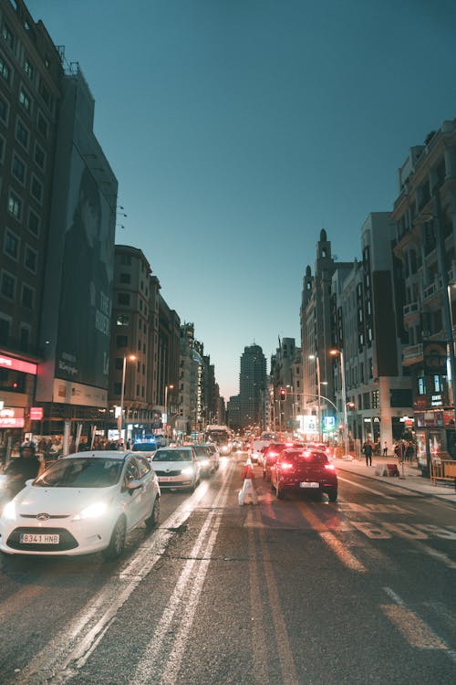 White Car on Asphalt Road during Dawn