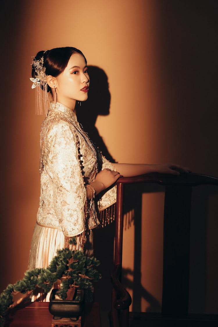 Woman In Traditional Dress Posing On Stairs