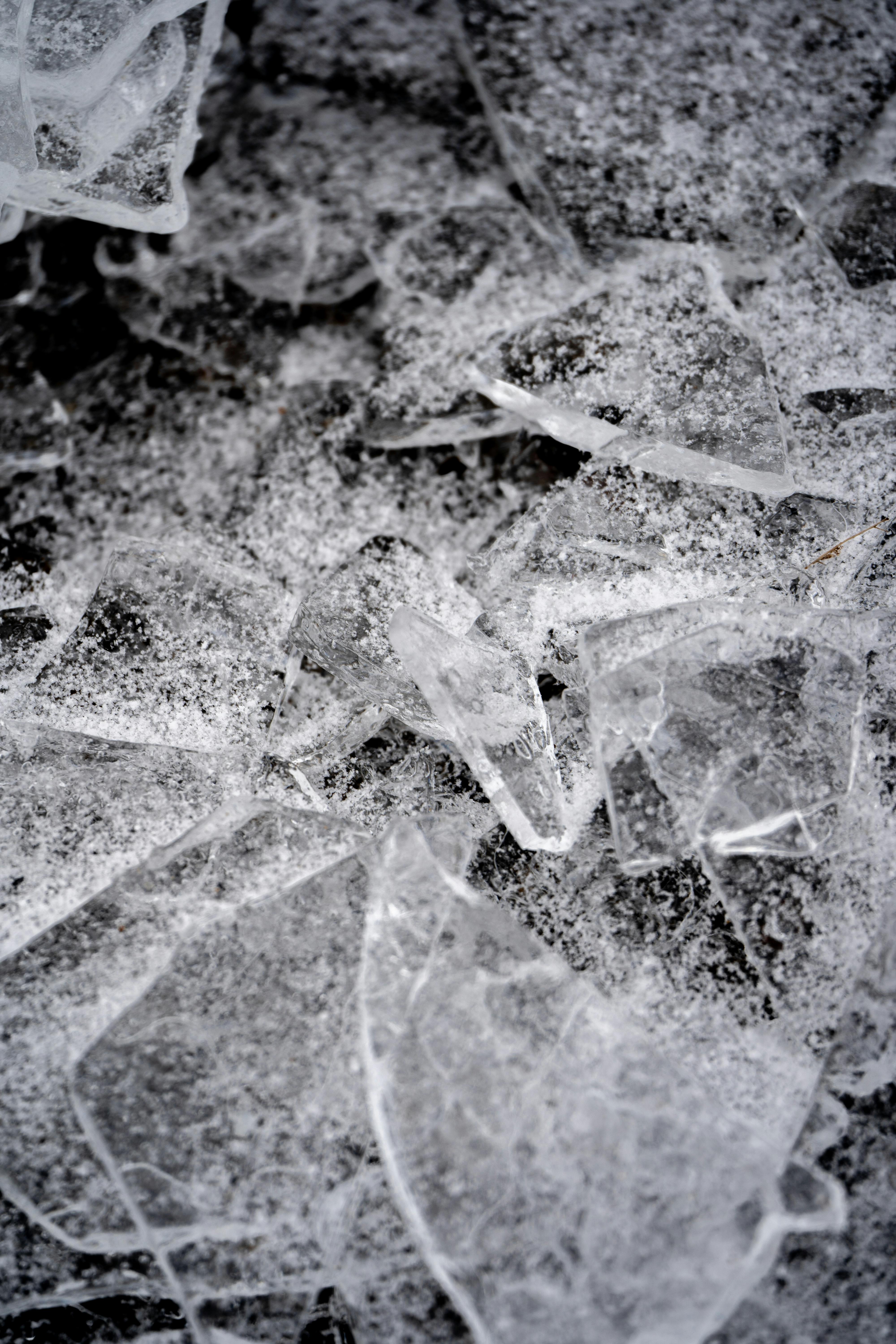 Broken Clear Glass Pieces on Black Surface · Free Stock Photo