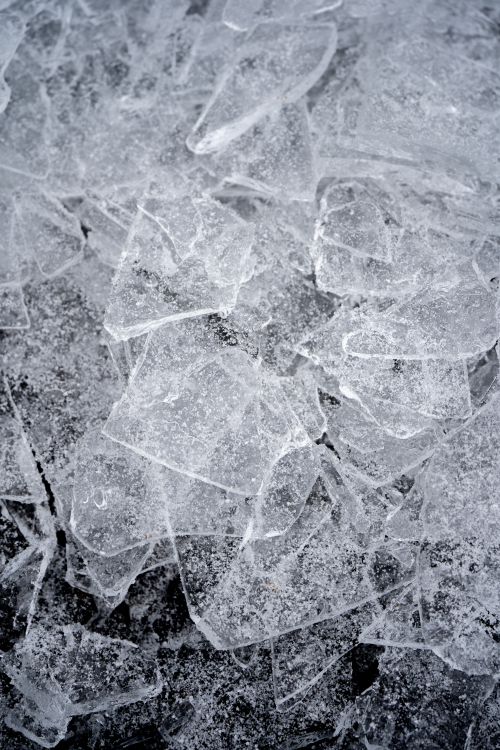 Free Detailed close-up of cracked icy surface in winter Toronto. Stock Photo
